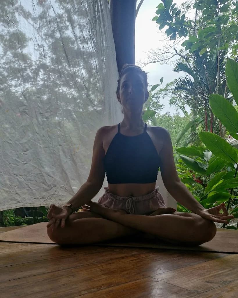 Marine in lotus on the wooden terrace, in meditation